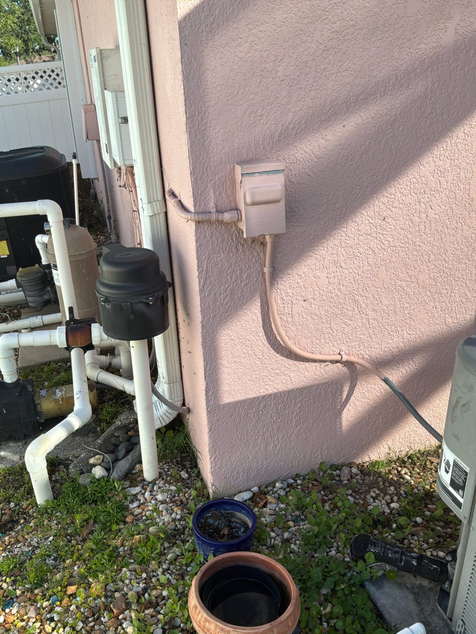 Disconnect box and conduit at the sauna circuit removal site