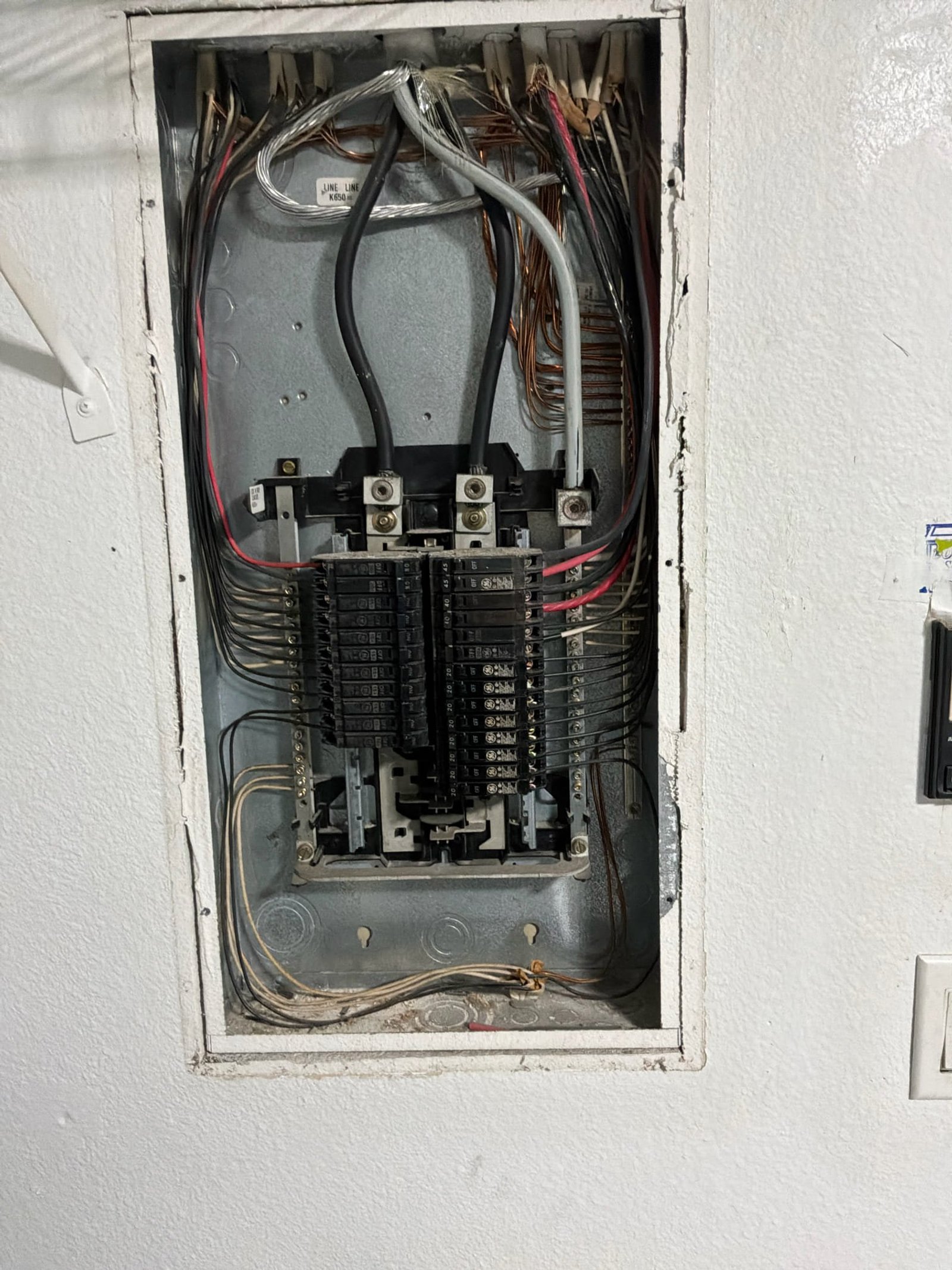 Service panel inspected while installing interconnected smoke and CO detectors