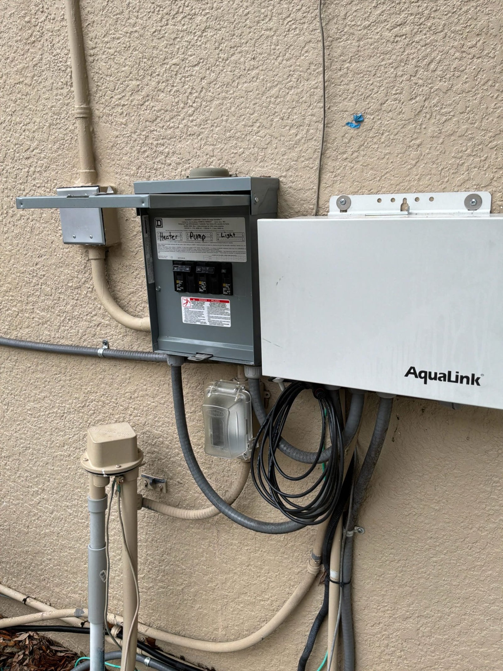 Pool equipment sub-panel served by the upgraded main with surge protection