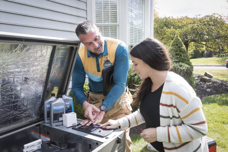 A Thomas Edison Electric electrician walking a homeowner through standby generator maintenance.