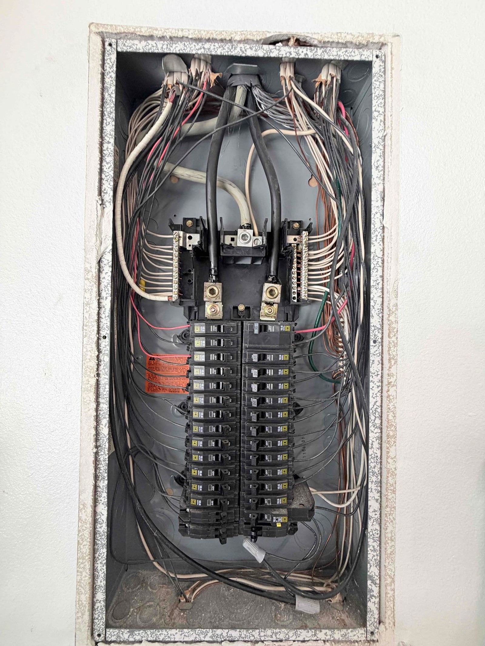 The inside of an electrical panel documented on a Smoke Detectors job in Lake Mary, FL.