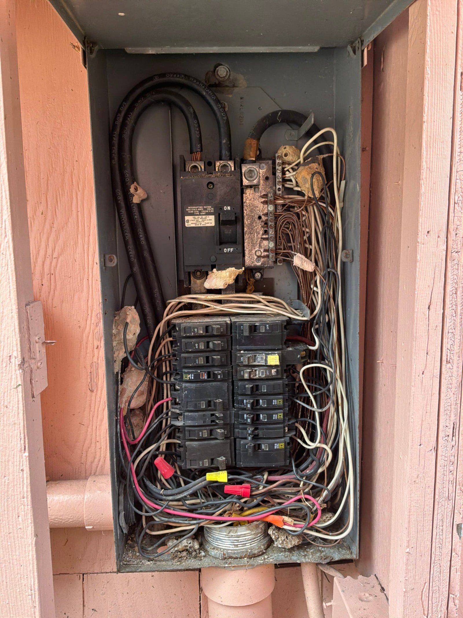 The inside of an electrical panel documented before the work on a Panel Service/Repair job in Oakland, FL.