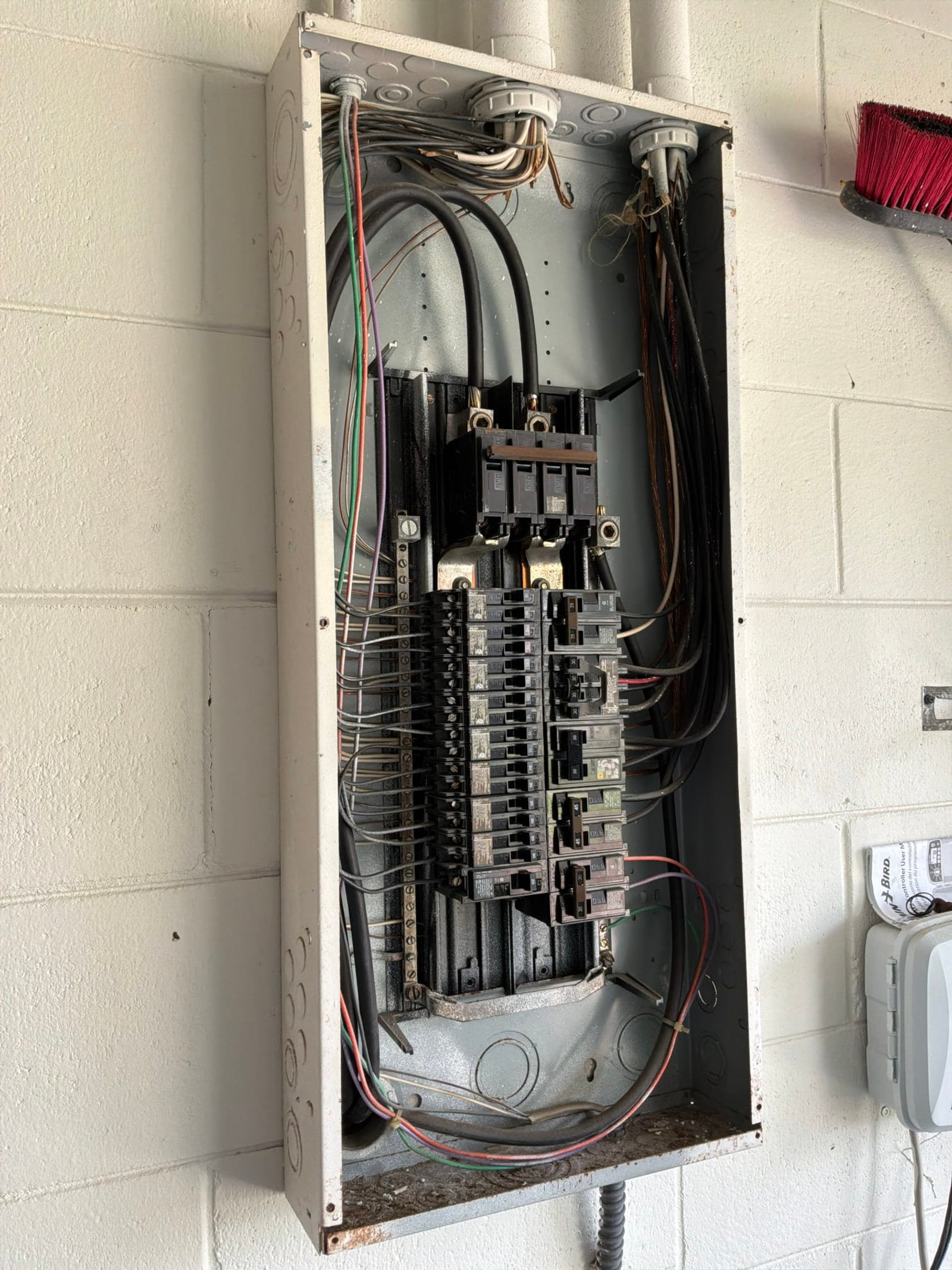 The original electrical panel documented before the work on a Pool Wiring job in Port Orange, FL.