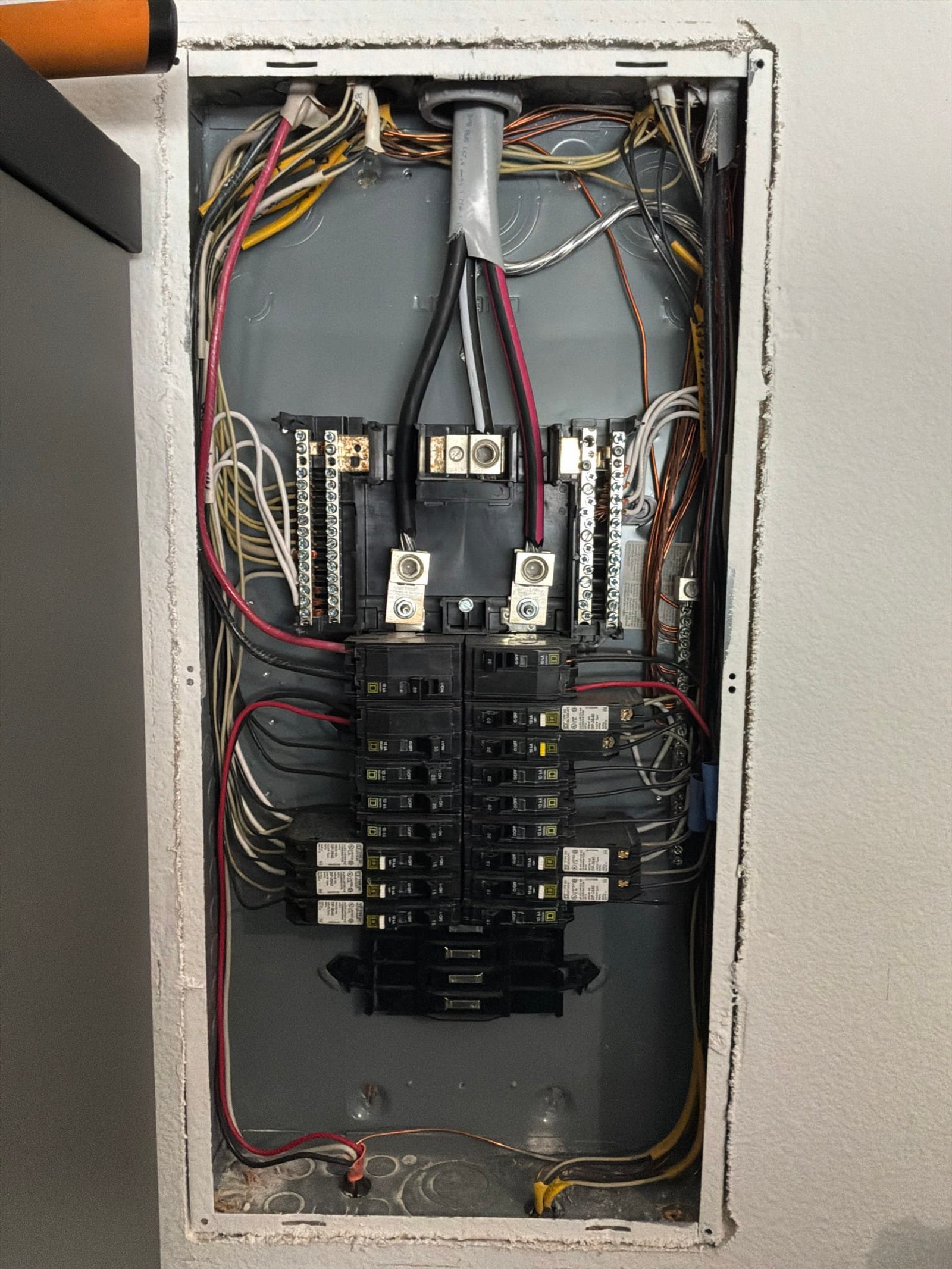 The inside of an electrical panel documented before the work on an Electric Fixture Service/Repair job in Winter Garden, FL.