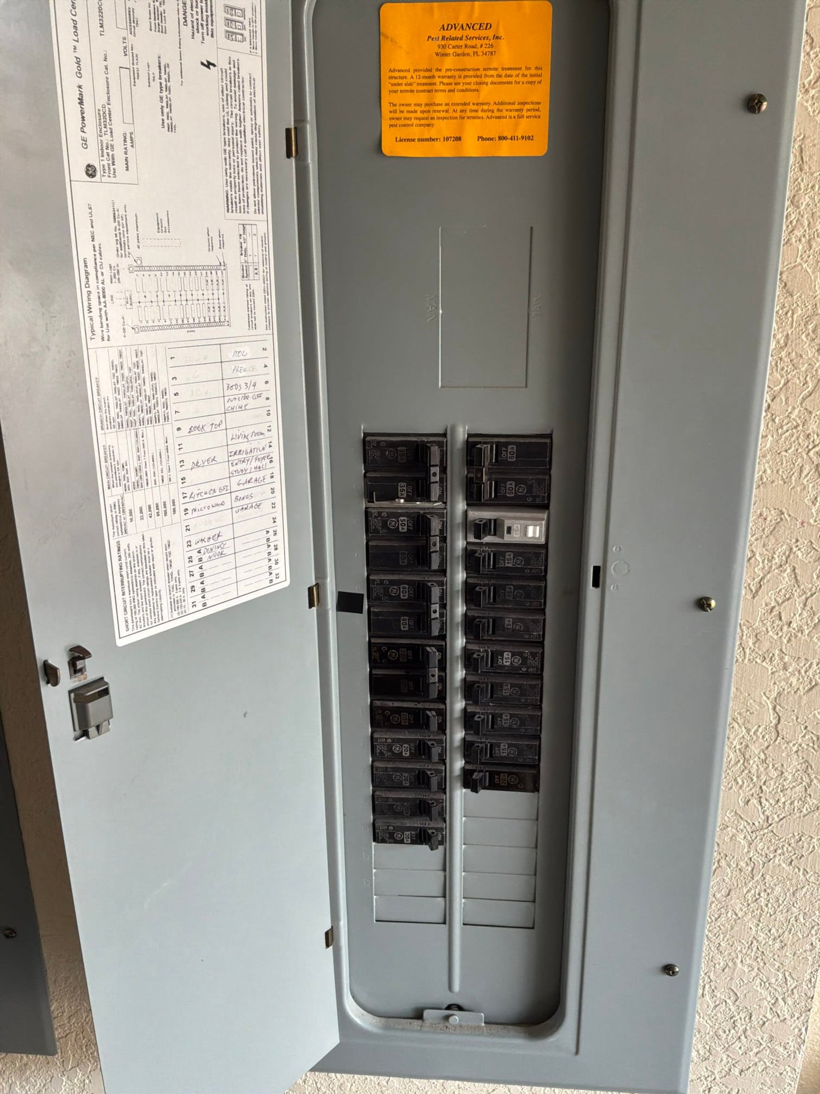 The electrical panel with its dead front in place documented before the work on an Outlet/GFCI-Repair/Replace job in Winter Garden, FL.