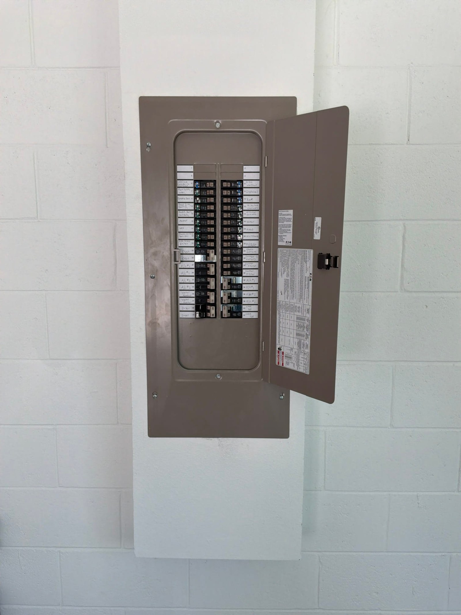The electrical panel with its dead front in place documented on an EV Charger Installation job in Lake Mary, FL.