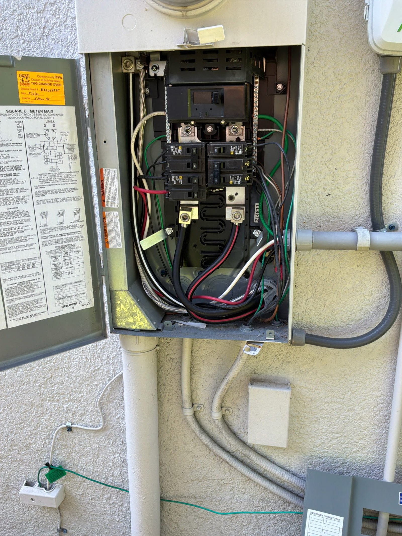 The inside of an electrical panel documented before the work on a Re-Wire job in Winter Garden, FL.